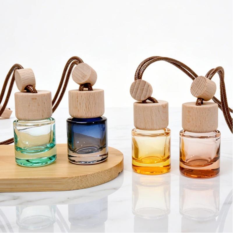 Car Air Freshener - Miniatuur ronde hanger essentiële olieverdamper flesje